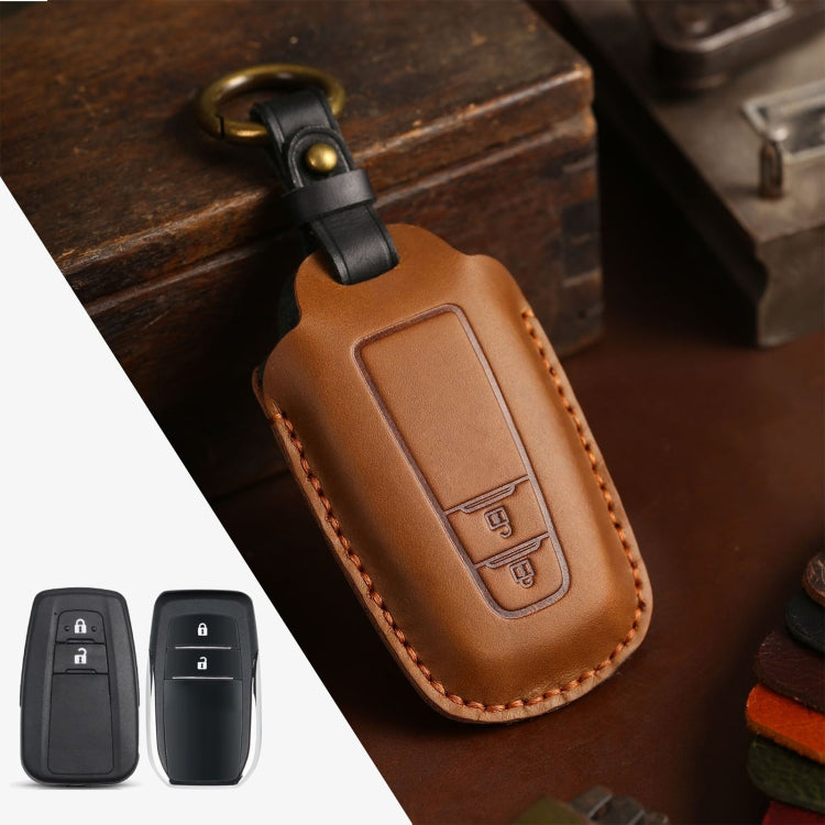 Brown cowhide leather key protective cover and case for Toyota Camry two-button car key fobs, designed for comfortable grip and protection.
