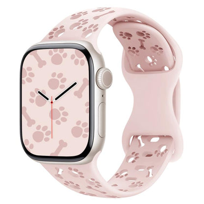 Silicone watch band for Apple Watch 42mm-38mm, dog paw bones and butterfly buckle design, in official pink, for smart watch owners.