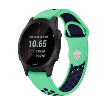Mint green and midnight blue silicone sports watch band with breathable punching design for Garmin Forerunner 945, comfortable and durable.